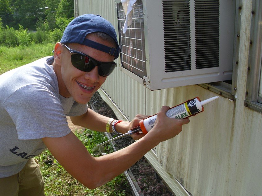 Kid fixing air conditioning